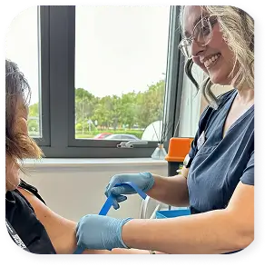 Phlebotomist carrying out a blood draw
